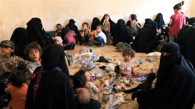 Families of Daesh terrorists are seen after they surrender themselves to the Kurdish Peshmerga forces in al-Ayadiya, northwest of Tal Afar, Iraq, on August 30, 2017. (Photo by Reuters)