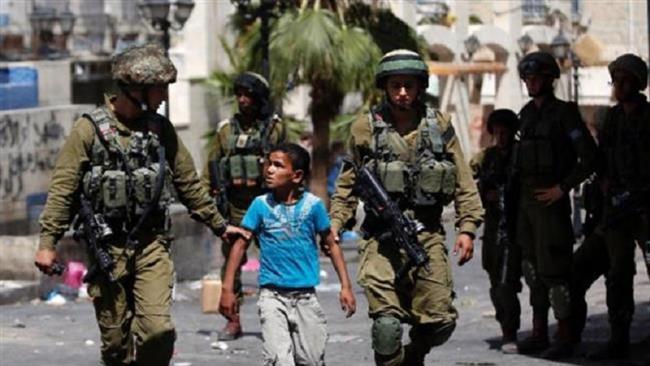 The undated photo shows Israeli troops arresting a young Palestinian.