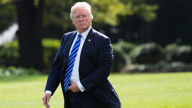 US President Donald Trump walks towards Marine One prior to departing from South Lawn of the White House in Washington, DC, on September 26, 2017. (Photo by AFP)