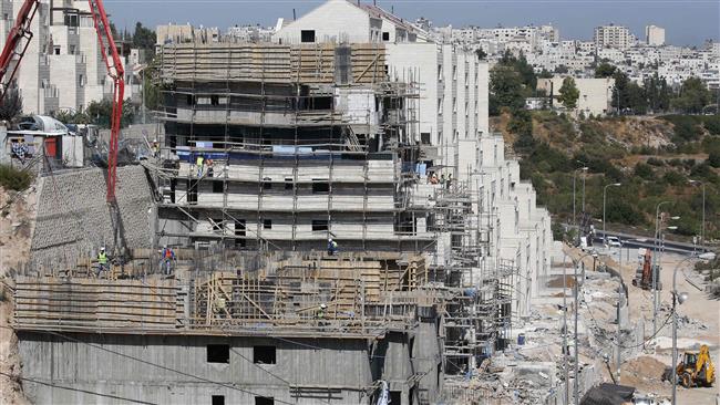 The photo shows a construction site for the Israeli settlement of Kiryat Arba, east the West Bank town of al-Khalil on August 24, 2017. (By AFP)