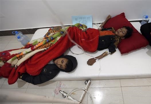 Young Yemenis suspected of being infected with cholera receive treatment at a hospital in the capital Sana’a on May 6, 2017. (Photo by AFP)