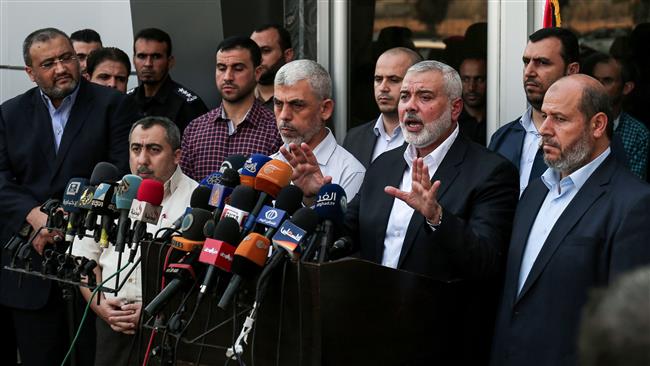 Hamas Chief Ismail Haniyeh (2nd from R) speaks to the press upon his arrival on the Rafah border crossing, in the southern Gaza Strip, on September 19, 2017. (Photo by AFP)