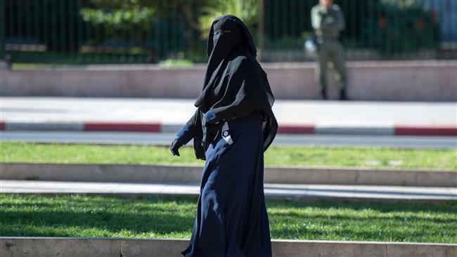 A woman wearing a niqab walks along a street in Rabat, Morocco, on January 15, 2017. (Photo by AFP)