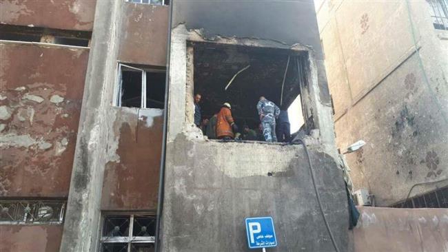 This Twitter photo shows aftermath of a bomb attack at a police station in al-Midan neighborhood of Syrian capital, Damascus.