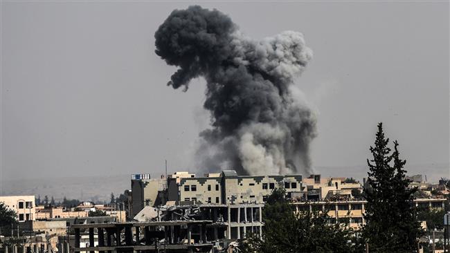Heavy smoke billows following an airstrike on the western frontline of Raqqah on July 17, 2017, during an offensive by the US-backed Syrian Democratic Forces, a majority Kurdish and Arab alliance, to retake the city from Daesh terrorists. (Photo by AFP)