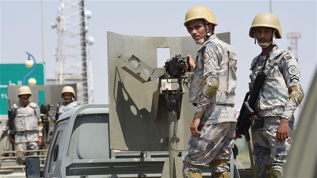 Saudi border guards stand guard in the closed al-Tuwal border crossing with Yemen in the southern Jizan province on October 3, 2017. (Photo by AFP)