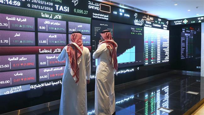 Investors monitor stock exchange at the Saudi Stock Exchange, or Tadawul. (file photo)