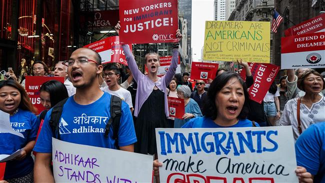 Protesters shout slogans against US President Donald Trump during a demonstration in support of the Deferred Action for Childhood Arrivals (DACA), also known as Dream Act, near the Trump Tower in New York on October 5, 2017. (AFP photo)