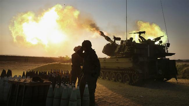 Israeli forces fire 155-mm artillery cannons at the Gaza Strip from their position near the border between the occupied Palestinian territories and the coastal enclave. (File photo)