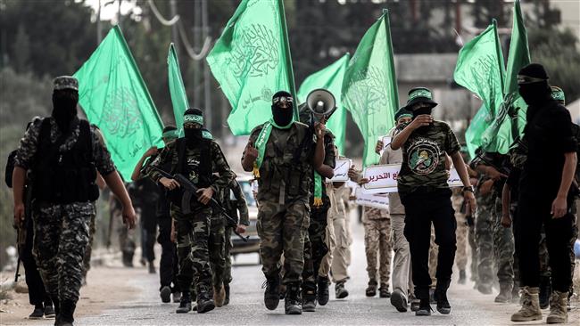 Masked youth cadets from the Ezzedeen al-Qassam Brigades, the military wing of the Palestinian resistance movement Hamas, march in the Gaza city of Khan Yunis on September 15, 2017. (Photo by AFP)