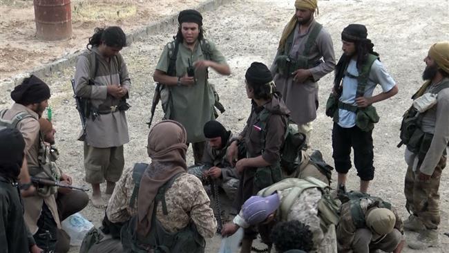 This file picture shows Daesh Takfiri militants at an unknown location in Syria.