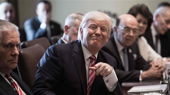 US President Donald Trump smiles during a cabinet meeting at the White House in Washington, DC, on June 12, 2017. (Photo by AFP)