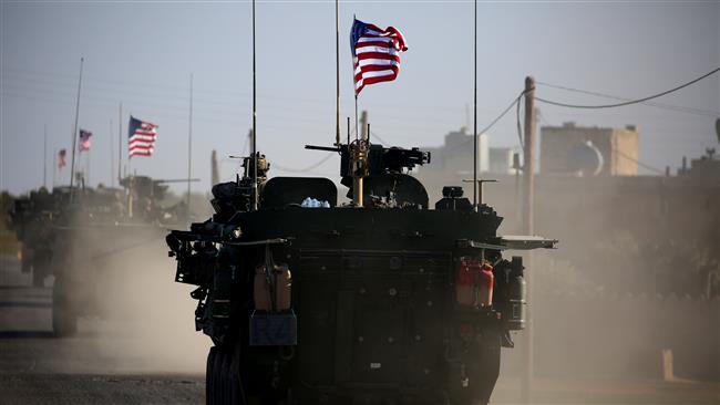 Picture taken on March 5, 2017 shows a convoy of US forces’ armored vehicles driving near the village of Yalanli, on the western outskirts of the northern Syria city of Manbij. (Photo by AFP)