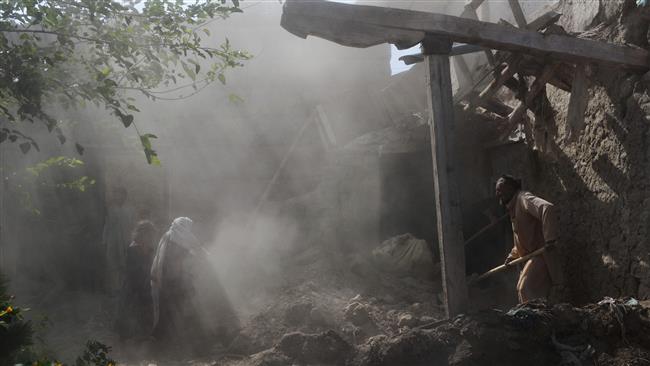 Afghan residents clear rubble from their homes after they were damaged by US airstrikes in the Achin district of Nangarhar province on September 12, 2017. (Photo by AFP)