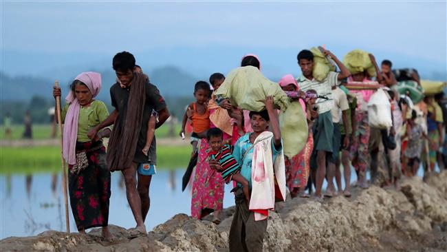 Rohingya refugees walk after crossing the border in Palang Khali, Bangladesh, October 9, 2017. (Photo by Reuters)