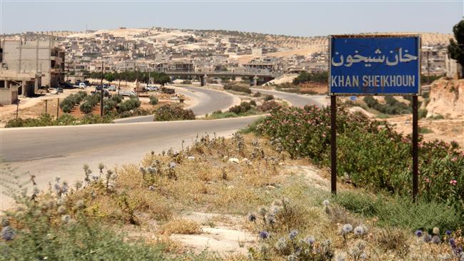 A picture taken on July 12, 2017 shows a sign on a road leading into Khan Sheikhun, a militant-held town in the northwestern Syrian Idlib Province, 100 days following a toxic gas incident. (By AFP)