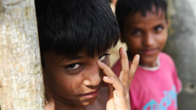 This photograph taken October 7, 2017 shows Rohingya refugee children outside a school at the Kutupalong refugee camp in the Bangladeshi district of Ukhia. (AFP photo)