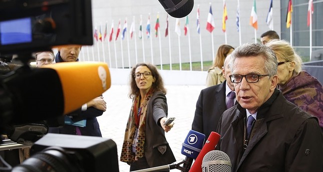 German Interior Minister Thomas de Maiziere speaks to media at the start of the Joint Justice and Home Affairs Council meeting in Luxembourg, 13 October 2017 (EPA Photo)