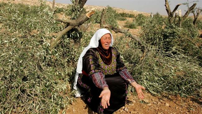 This file photo shows a Palestinian woman grieving as her family