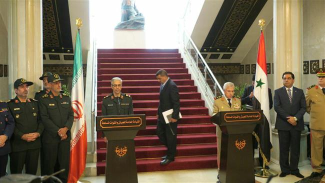 Major General Mohammad Baqeri (L), who is the chairman of the Chiefs of Staff of the Iranian Armed Forces, and Chief of the General Staff of the Syrian Arab Army General Ali Abdullah Ayyoub hold a joint press conference in Syria’s capital, Damascus, October 18, 2017.