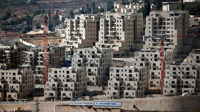 Buildings are seen under construction on October 17, 2017 at the Israeli settlement of Ramot, located in a neighborhood of the occupied East Jerusalem al-Quds. (Photo by AFP)