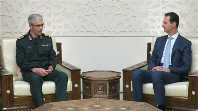 Major General Mohammad Baqeri (L), who is the chairman of the Chiefs of Staff of the Iranian Armed Forces, meets Syrian President Bashar al-Assad in Damascus, Syria, October 19, 2017.