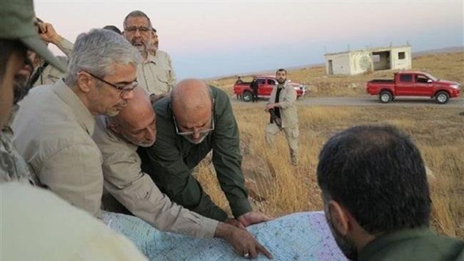 Chairman of the Chiefs of Staff of the Iranian Armed Forces, Major General Mohammad Baqeri (L), meets with Iranian military advisors in the northwestern Syria province of Aleppo (Photo by Tasnim News Agency)