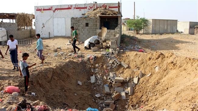Yemeni children gather at a crater left at the site of an airstrike by the Saudi-led coalition against a health center in the area of Abbas in the northern province of Hajjah, on October 7, 2017. (Photo by AFP)
