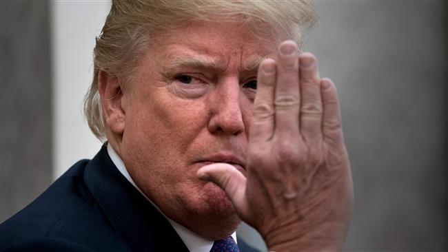 US President Donald Trump while making a statement for the press before a meeting with Governor of Puerto Rico Ricardo Rossello and others in the Oval Office of the White House October 19, 2017 in Washington, DC. (Photo by AFP)