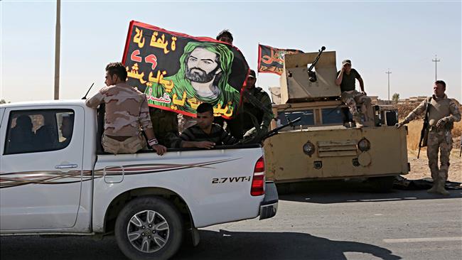 Iraqi security forces and Popular Mobilization Forces take control of a former Kurdish security forces checkpoints and positions outside the northern city of Erbil on October 18, 2017. (AP photo)