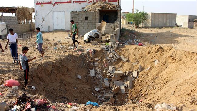 Yemeni children gather at a crater left at the site of an air strike by the Saudi-led coalition against a health center in the area of Abbas in the northern province of Hajjah, on October 7, 2017. (Photo by AFP)