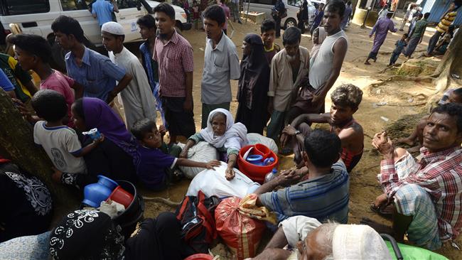 Rohingya Muslim refugees are seen after crossing into Bangladesh from Myanmar on October 24, 2017. (Photo by AFP)