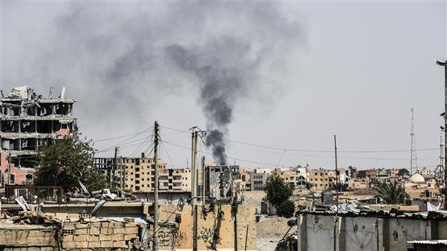 Smoke is seen following an airstrike on the western front line of the Syrian city of Raqah on July 17, 2017.