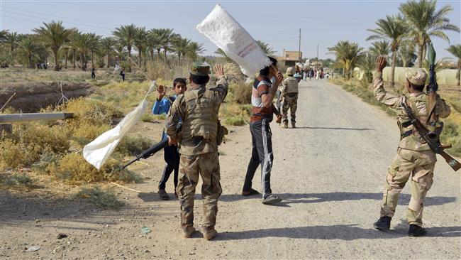 In this October 10, 2016 photo, villagers welcome soldiers of the Iraqi army after they flushed out Daesh terrorists from villages outside Ramadi, Anbar province, Iraq. (Photo by AP)
