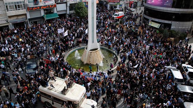 Palestinians participate in a march on November 2, 2017 in the center of the West Bank city of Ramallah to protest the 100th anniversary of Britain