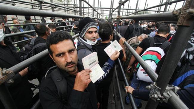 Iranian pilgrims gather at the Mehran border crossing where they are awaiting permit to enter Iraq.