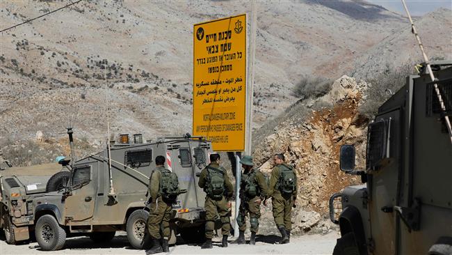 Israeli soldiers stand guard near the Syrian border next to the town of Majdal Shams in the Israeli-occupied sector of the Golan Heights on November 4, 2017, a day after an attack in the Syrian Druze village of Hader. (Photo by AFP)
