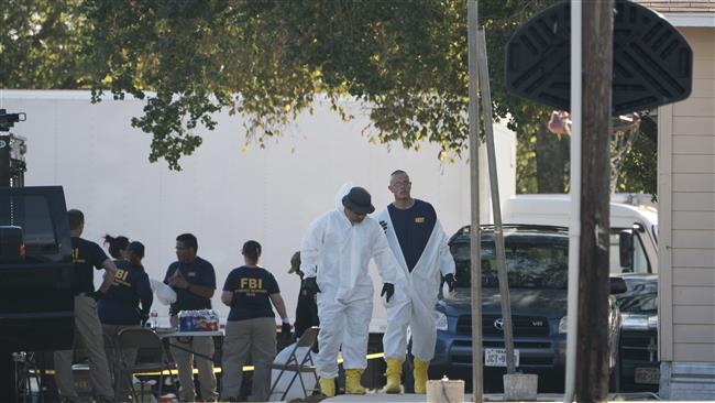 Members of the FBI walk behind the First Baptist Church of Sutherland Springs after a fatal shooting on November 5, 2017, in Sutherland Springs, Texas. (Photo by AP)