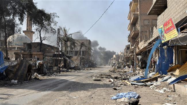 A picture taken on October 20, 2017 shows damaged buildings in the town of Mayadin in northeastern Syria. (By AFP)