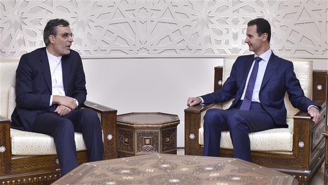 Iranian Deputy Foreign Minister for Arab and African Affairs Hossein Jaberi Ansari (L) meets with Syrian President Bashar al-Assad in the Syrian capital, Damascus, November 16, 2017.