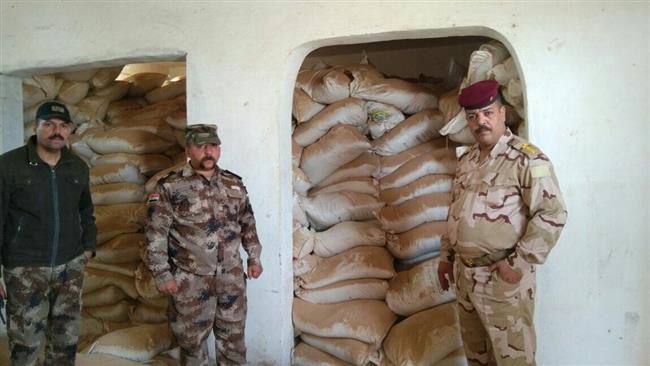 This picture provided by Arabic-language al-Qurtas News news agency shows Iraqi forces at a major Daesh chemical depot in the Salman district of al-Qa’im town, western Iraq.