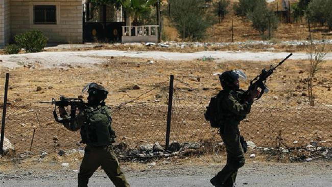 Israeli forces take aim during clashes with Palestinians in the West Bank village of Tuqu’, August 5, 2017. (Photo by AFP)