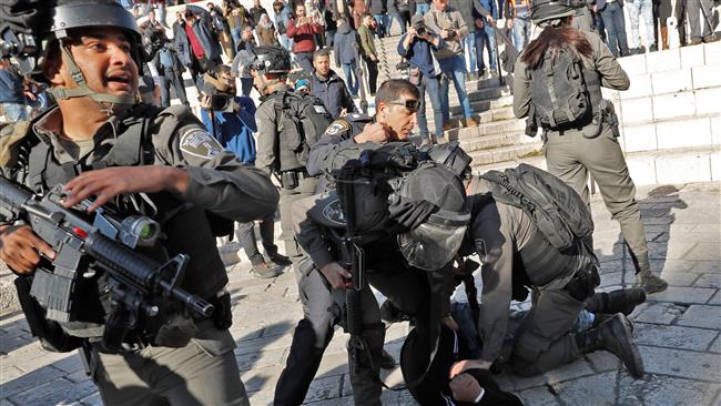 Israeli forces detain a Palestinian man at Damascus Gate in the occupied Old City of Jerusalem al-Quds on December 8, 2017. (Photo by AFP)