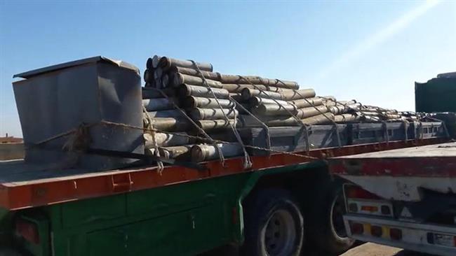 A picture showing a cache of weapons and arms seized by Syria forces in the Dayr al-Zawr province on December 9, 2017 (Photo by SANA)