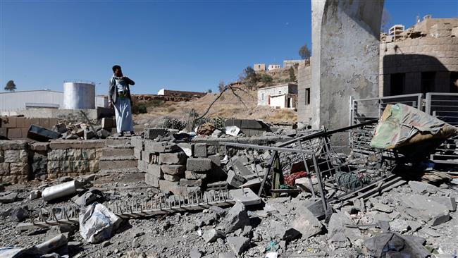A Yemeni man looks at the damage in the aftermath of an air strike by the Saudi-led coalition on the state TV station controlled by Houthi fighters in the capital Sanaa, on December 9, 2017. (Photo by AFP)