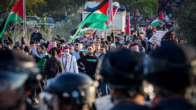 This photo taken from Israeli media shows people holding a protest against the US and Israel in the Wadi Ara region of the occupied territories on December 9, 2017.