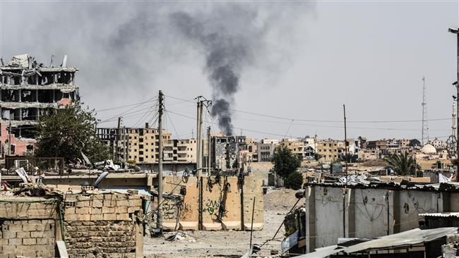 Smoke is seen following a US airstrike on western Raqqah, Syria, on July 17, 2017. (Photo by AFP)