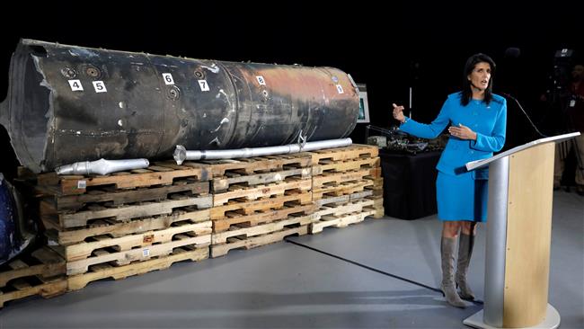 US Ambassador to the United Nations Nikki Haley briefs the media in front of remains of what is said to be a Yemeni missile at the Joint Base Anacostia-Bolling military installation in Washington on December 14, 2017. (Photo by Reuters)