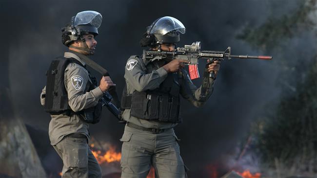 Israeli forces take position during clashes with Palestinian protesters in the West Bank town of Tulkarem on December 11, 2017. (Photo by AFP)