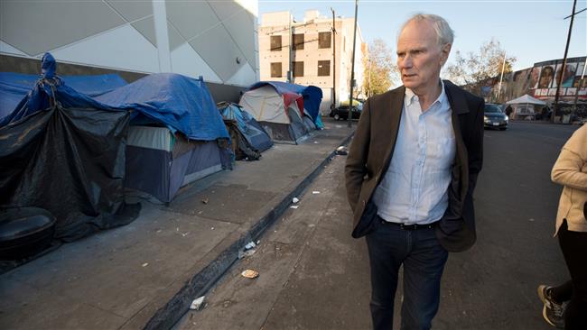 Philip Alston seen visiting a homeless camp in Downtown, Los Angeles, California (Photo via The Guardian)